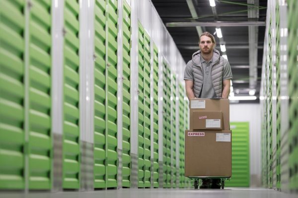 man-working-logistic-center-full-shot_23-2148943327
